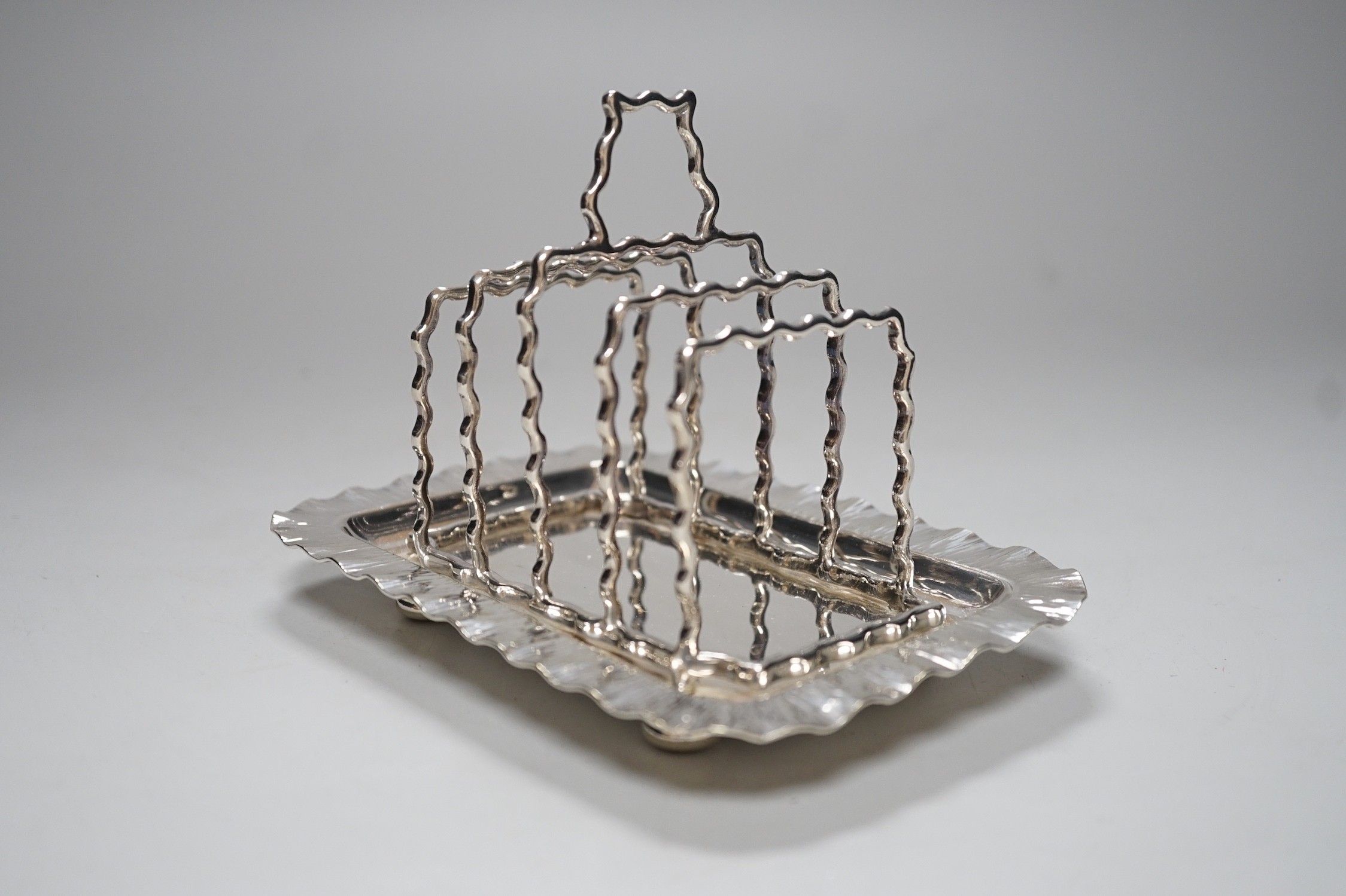 A Hukin & Heath silver plated toast rack, 16cm long